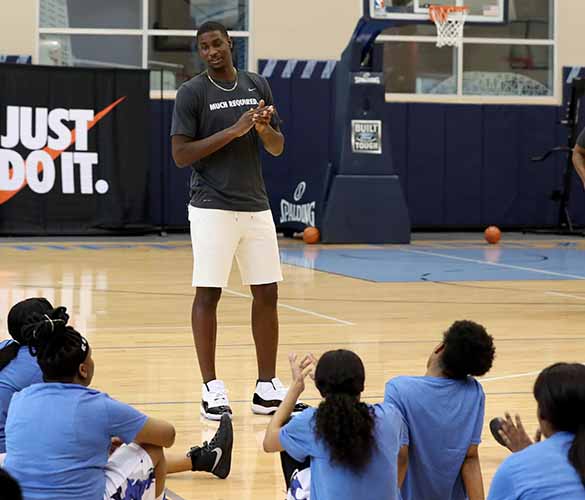 Jaren Jones Jr. speaking to the participants of a girl's basketball camp